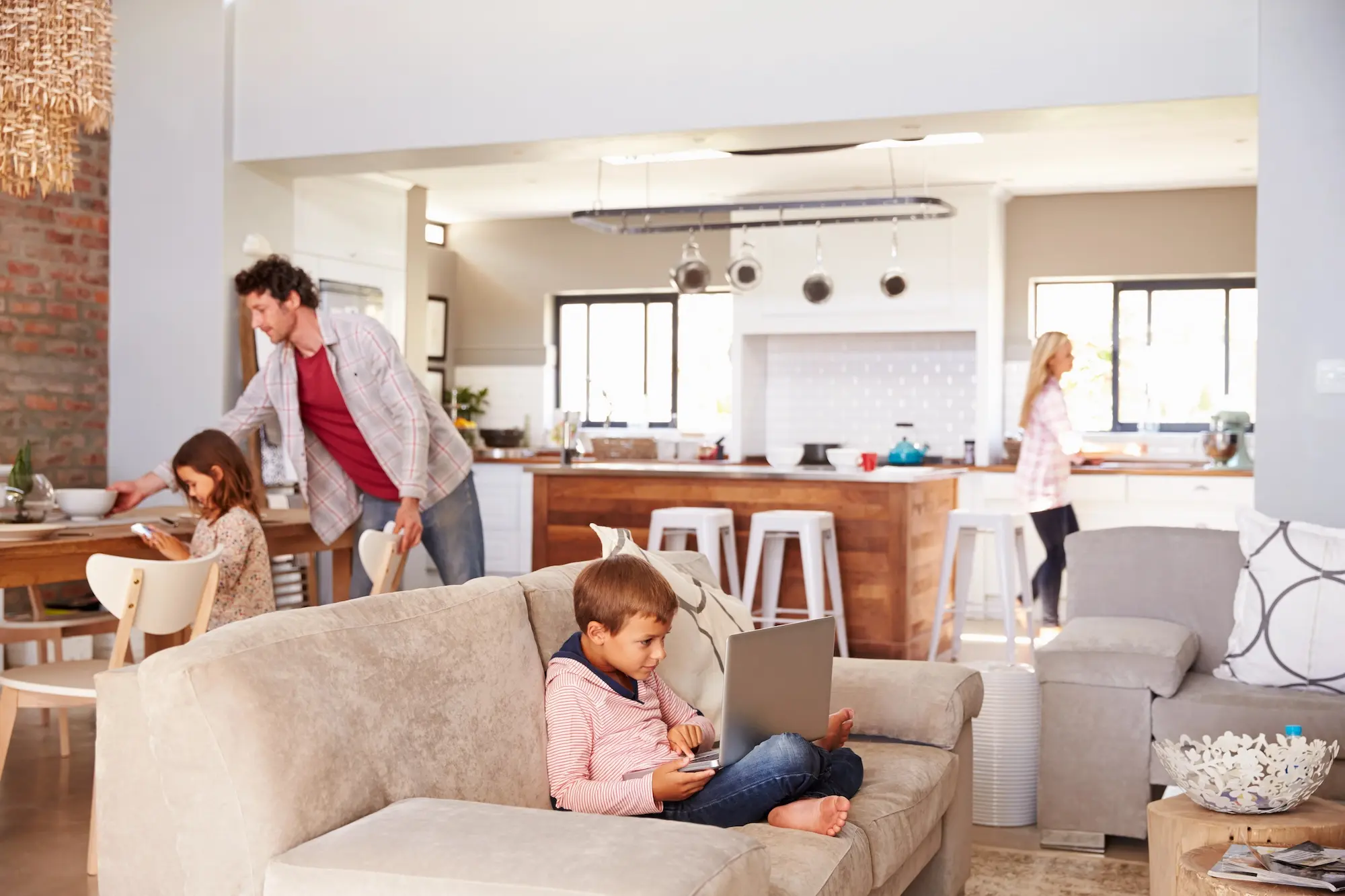Family spending time together in a clean, modern rental home reflecting stability and long-term tenancy