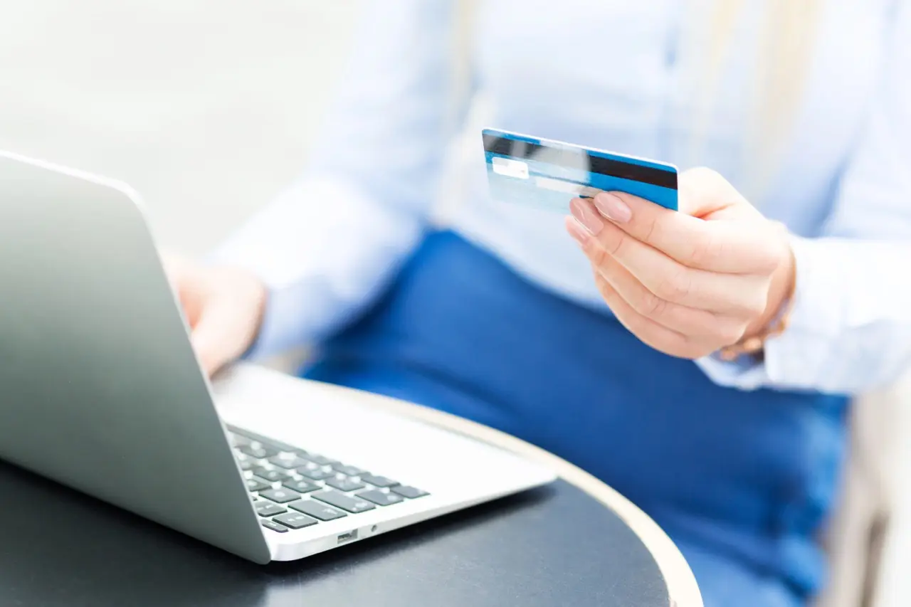 Paying rent online with a credit card using a laptop