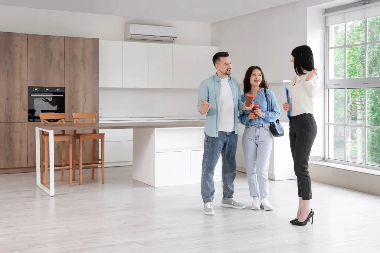 Apartment tour with a rental agent explaining unit details to renters